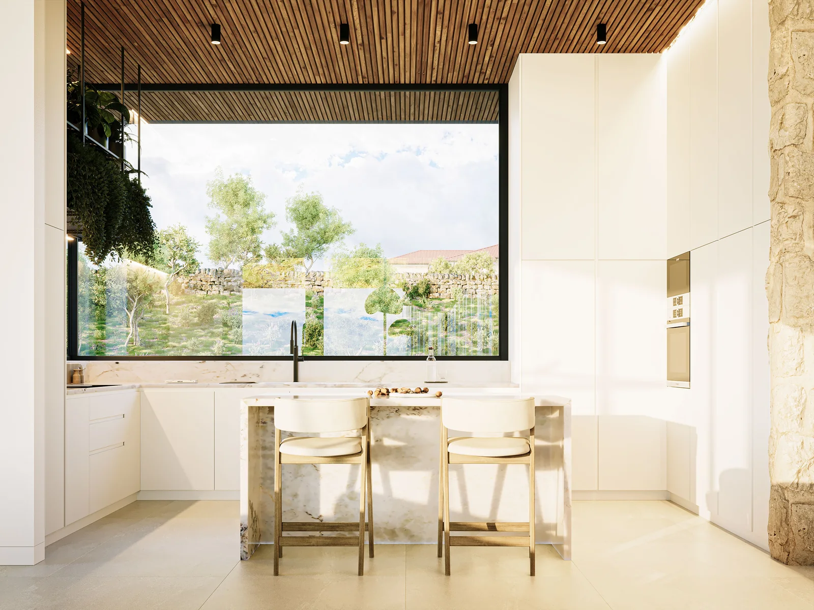 The kitchen: a white island with three stools under a timber-slatted ceiling, tall units to the right and a wide window framing the vineyard terraces outside.