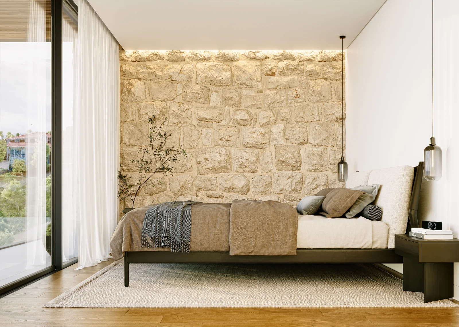 A bedroom with a low bed against a wall of dressed stone, a slim pendant to one side, a climbing plant in the corner and sheer curtains at a full-height opening.