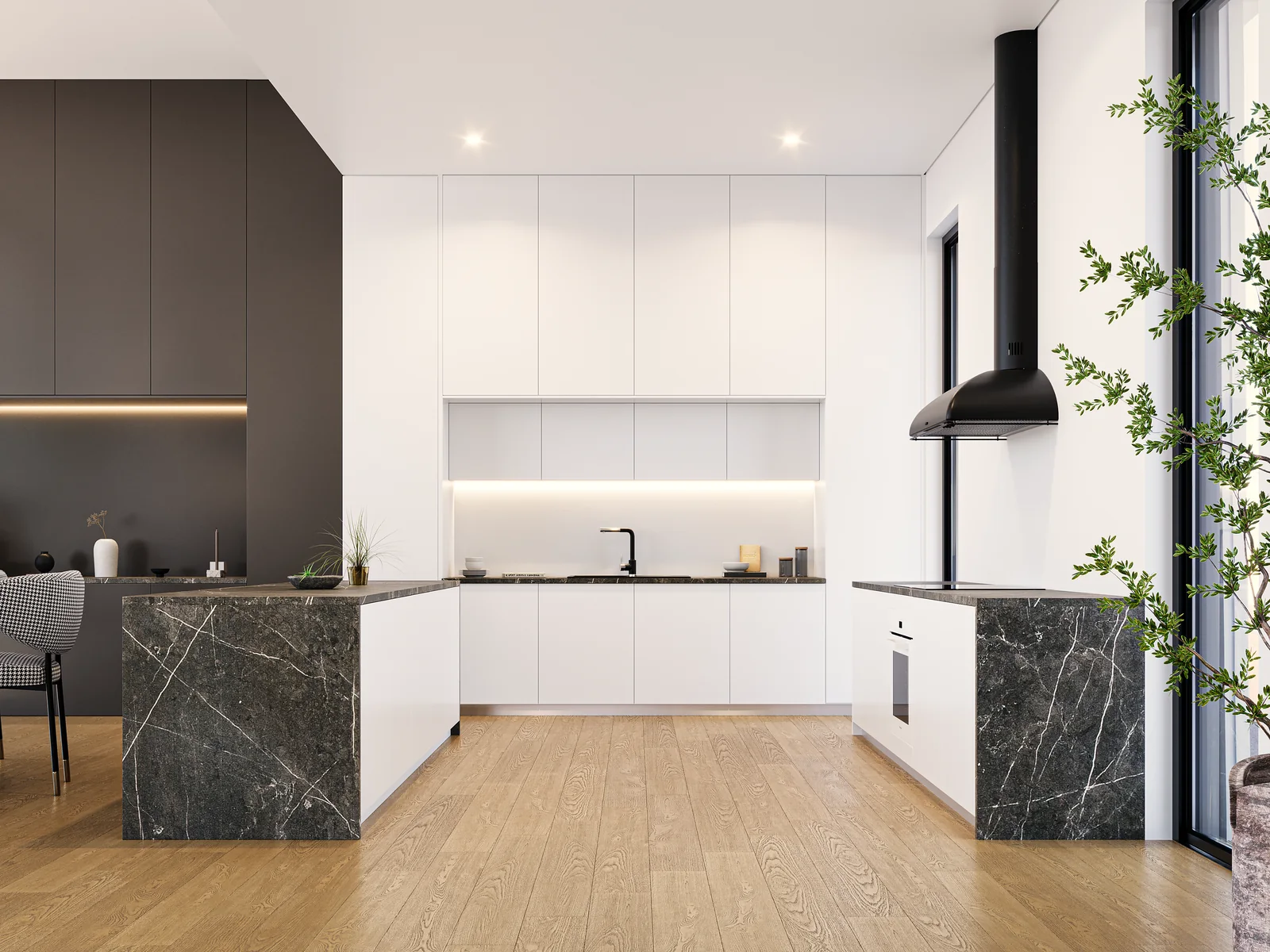 A kitchen with white joinery, dark stone worktops and a black extractor dropped from the ceiling.