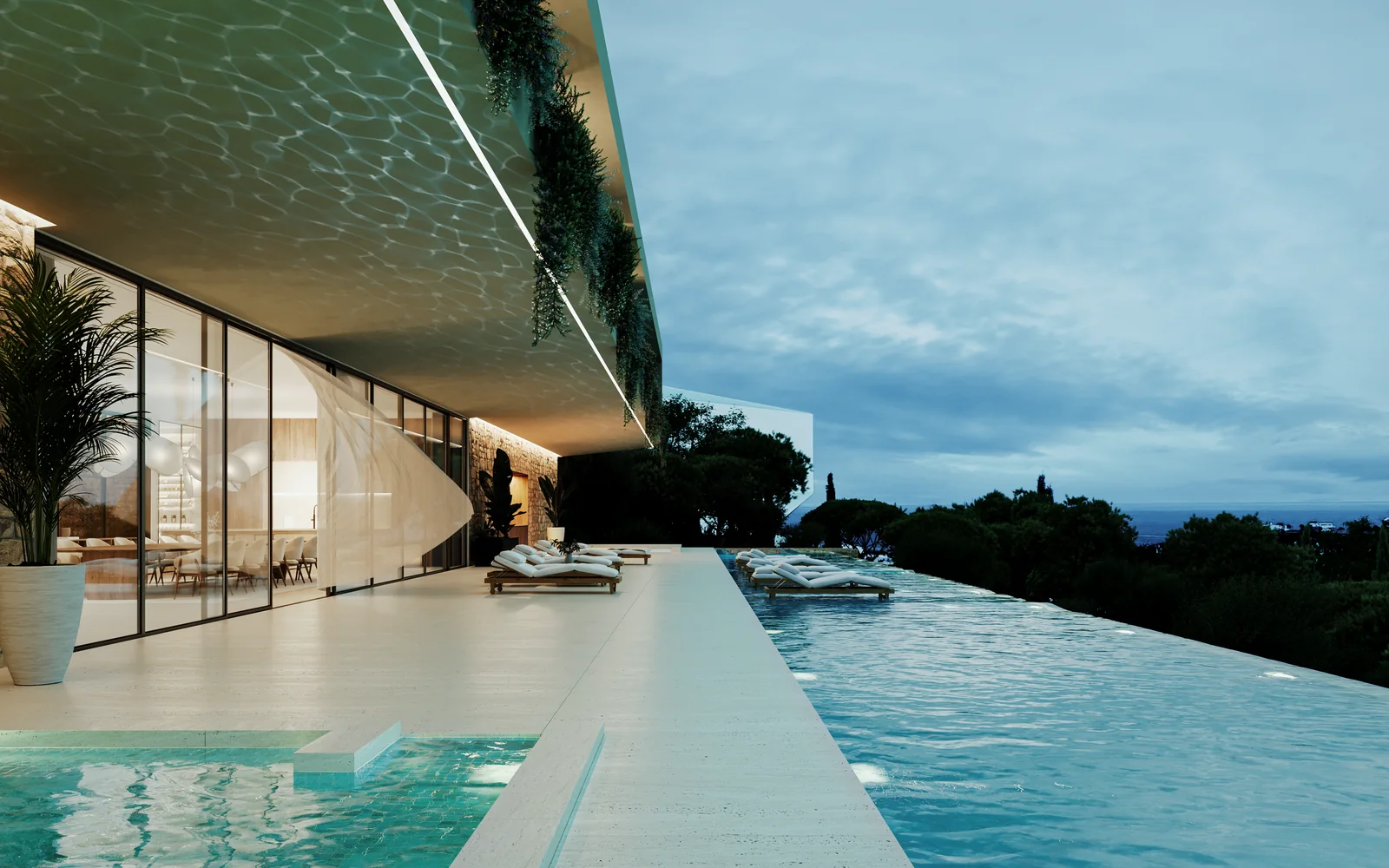 The same pool at dusk, lit from below, a continuous line of light under the roof edge and the sea gone dark beyond.