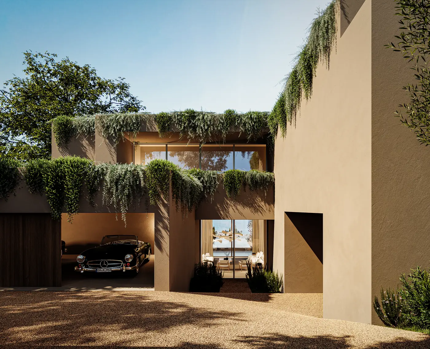 The entrance: a covered opening cut between two rendered volumes with a car standing under it, planting hanging from the parapet above and the house visible straight through to the garden beyond.