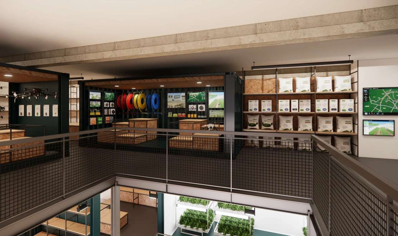 From the upper floor, over a steel mesh balustrade, looking down through the void onto the growing trays on the level below; shelving and screens line the wall alongside.