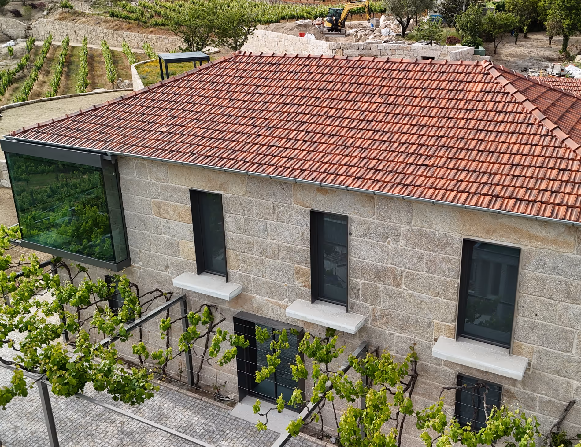 Stone house set among terraced vineyards in the Douro, restored and built by WALLNUT.